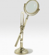 This fully functioning standing magnifier is crafted in a vintage-inspired silhouette from antiqued brass. 11½H X 4 diam.Brass and glassImported