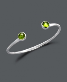 Add a little cultural inspiration to your look with this vibrant bangle by Studio Silver. Round-cut green glass adds a colorful touch to a polished sterling silver bangle setting. Bracelet slips easily over the wrist. Approximate diameter: 2-1/2 inches.