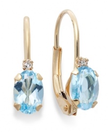 Sparkling perfection. Add a vibrant pop of color to your look with oval-cut blue topaz (9/10 ct. t.w.) and sparkling diamond accents. Crafted in a 14k gold leverback setting. Approximate drop: 3/4 inch.