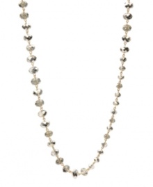 Stunning and stylish. Kenneth Cole New York's long station necklace is adorned with a chic combination of small, medium and large faceted glass accents in shimmering silver. Crafted in gold tone mixed metal. Approximate length: 42-1/2 inches.