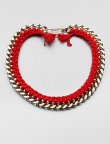 A chunky chain, with the look of a vintage ID bracelet, is modernized with bright red braiding with tassels and a fun paper-clip clasp.GoldplatedCottonLength, about 16.5Spring ring paper clip claspMade in France