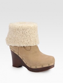 An on-trend leather essential featuring a plush shearling cuff, wooden heel and edgy metal studs. Wooden heel, 4 (100mm)Wooden platform, 1¼ (30mm)Compares to a 2¾ heel (70mm)Leather and shearling upperShearling liningRubber solePadded insoleImported