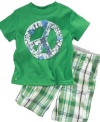 Peace maker. His laid-back nature will shine through in this t-shirt and cargo-short set from Kenneth Cole.