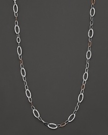 Sterling silver links, accented with 18K. pink gold. By Tacori.