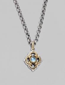 Chic little blossom accent in gleaming sterling silver and 18k gold, centered with a smooth cabochon blue topaz stone. Chain sold separately About ½W X ¾H Imported