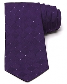 Retro-inspired patterning meets modern innovation in this narrower silk tie from John Varvatos Star USA.