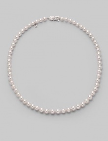 From the Akoya collection. A classic strand of white Akoya pearls with a pretty filigree clasp. 6.5mm white round cultured pearls Quality: A1 18k white gold Length, about 18 Mikimoto signature clasp Imported