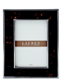 The alluring beauty of multi-faceted Tortoise shell finish presents a warm accent to clean stainless steel in this refined picture frame from Lauren by Ralph Lauren.