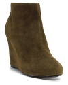 Suede falls softly over a bold wedge silhouette, a bold and brilliant way to wear the bootie trends. By Pour La Victoire.