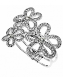 Dazzle them with this flirtatiously feminine design. GUESS's sparkling crystal bracelet will have you going cuff crazy. Design features three, cut-out flowers set in silver tone mixed metal. Secures with a hinge clasp. Approximate diameter: 2-3/4 inches.