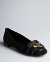 Tory Burch keeps the amazing flats coming. These elegant loafers feature stand-out logo embellishments.