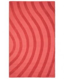 Abstract and absorbing, this rose-colored rug adds movement to any room. Playful, wavy lines reverberate against a warm red ground, resounding with personality in your home.