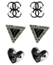 Triple up on style featuring everyone's favorite brand. GUESS's three pair stud earrings set features the quattro G, the signature triangle logo, and logo-imprinted hearts. Crafted in silver tone mixed metal with jet epoxy and crystal accents. Approximate diameter: 1/4 inch each.