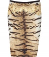 Bring bold style to your day or night look with this luxe printed stretch silk skirt from Roberto Cavalli - Slim pencil silhouette, all-over animal print with black trim and scarf print at hips, concealed side zip closure - Style with a sheer blouse, a bold shoulder blazer, and platform pumps