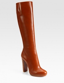 Richly hued leather in a knee-high silhouette with a side zipper, sky-high heel and signature red leather sole. Stacked heel, 4 (100mm)Covered platform, ½ (15mm)Compares to a 3½ heel (90mm)Shaft, 15½Leg circumference, 14Leather upperSide zipperLeather liningSignature red leather solePadded insoleMade in ItalyOUR FIT MODEL RECOMMENDS ordering one size up as this style runs small. 