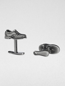 If the shoe fits, wear it on your sleeve with these sterling silver and black rhodium cuff links.Sterling silverShoe horn-shaped backAbout .87 diam.Made in USA