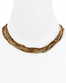 Follow your feline instincts and flaunt MICHAEL Michael Kors' tiger's eye torsade necklace--the captivating collar lend exotic flair to staple tees or femme blouses.