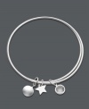 Be charmed by this adorable Studio Silver style. Two sterling silver bangles are held together by three, unique charms including a star, and two circle charms. Approximate diameter: 2-1/2 inches.