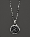 Sterling silver, jointed like a bamboo stalk, circles glittering pavé black sapphire gems on a pendant suspended from a delicate adjustable chain.