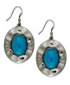 Oval appeal. Style&co. takes the shape and brings it full circle in this set of drop earrings. Crafted from hematite tone mixed metal, it features oval teal resin beads at the center. Approximate drop: 1-1/2 inches.