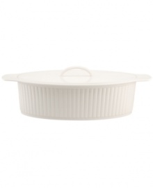 A bread basket woven of crisp white porcelain with embossed detail lends easy elegance to casual meals. From Martha Stewart Collection.