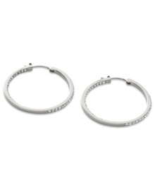 Go full-blitz with these glitzy hoop earrings from Fossil. The classic design is amped up with clear pave crystal accents. Crafted in polished stainless steel. Approximate diameter: 1-3/8 inches.