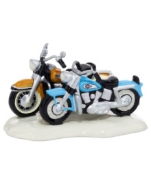 Nice ride. A couple of hogs parked outside Snow Village's Harley-Davidson Road House are the envy of everyone driving by. A figurine for bikers, from Department 56.