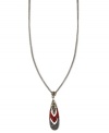 Make a colorful statement. Givenchy's necklace is crafted from hematite-tone mixed metal with a sparkling pendant of black-, red- and gold-colored crystals for a truly dazzling touch. Approximate length: 16 inches + 2-inch extender.