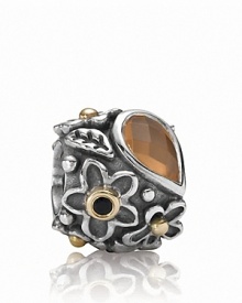 An orange moonstone 'dew drop' stone grounds a sterling silver PANDORA charm with a gold and onyx-accented floral motif.