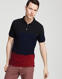 A mellow color-block polo from MARC BY MARC JACOBS in slightly understated tones sets you off in style, perfect for trips downtown or leisure-time activities.