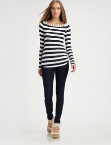 Bold sailor stripes lend graphic appeal to this sleek stretch knit.Contrast boatneck with button detailsLong sleevesShirrtail hemPullover styleAbout 26 from shoulder to hem96% rayon/4% spandexDry cleanMade in USAModel shown is 5'9 (175cm) wearing US size Small.