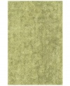 Add a pop of pure, shimmering green to any modern room with the Metallic area rug from Dalyn. Hand-tufted of soft polyester, this high-luster shag area rug puts comfort and fun back in floor decor.