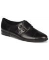 Sleek and minimal. Etienne Aigner's Kalani flats are menswear inspired and feature two buckled straps across the vamp.