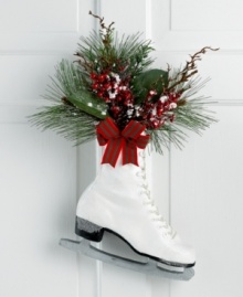 Hang up your skates. With frosted accents and a fresh holiday bouquet, this classic boot offers a whimsical expression of the season.