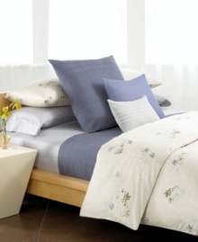 As peaceful as a spring meadow, the Calvin Klein Rhone comforter set exudes a natural sensibility with a modern flair. Stamped flowers in tones of lilac and fatigue dance across a tonal, combed cotton background for a look of relaxed beauty.