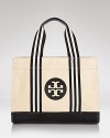 Uptown girls will love Tory Burch's update of it's signature tote. In twill with bold logo detailing, it encapsulates casual chic.