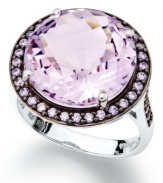 Punctuate your look with pastels. This stunning sterling silver ring highlights a round-cut natural pink amethyst (7-1/5 ct. t.w.) and a halo of round-cut purple Swarovski zirconias (5/8 ct. t.w.). Size 7.