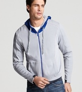 Crafted in soft pima cotton, this breathable zip hoodie reverses to the trim's color.