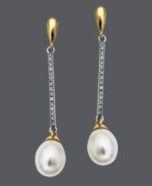 Dust your shoulders with this elegant style. A 14k gold and 14k white gold setting adds versatility to cultured freshwater pearl drops (7-9 mm) and sparkling, round-cut diamonds (1/10 ct. t.w.). Approximate drop: 1-1/2 inches.