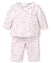 Rendered in heart print Pima cotton, this pink and white Kissy Kissy set features a ruffle trim top and basic pants.