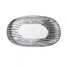 Organically molded under fire, this handmade platter exudes metal artistry with a New York edge.