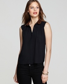 This DV Dolce Vita sleeveless button-up top is boldly punctuated by a leopard-print collar for a hint of the exotic.