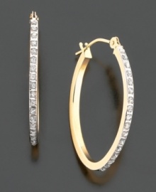 Classic elegance. Must-have 14k gold diamond-accented oval-shaped hoop earrings. Diameter measures 1-3/4 inch.