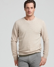 Luxurious cashmere and a classic silhouette make this cozy cashmere sweater this season's must-have item.