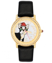 The perfect holiday accessory in an adorable package, by Betsey Johnson. Watch crafted of black leather strap and round gold tone mixed metal case. Bezel embellished with crystal accents. White dial features glittery Santa dog graphic with crystal accents, gold tone numerals, gold tone hour and minute hands, signature fuchsia second hand and logo. Quartz movement. Water resistant to 30 meters. Two-year limited warranty.