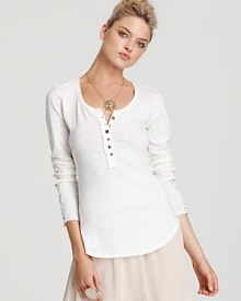 Ruffles and lace lend feminine appeal to Free People's cotton, crochet-embellished henley. Wear it with a full skirt and strappy wedges for a complete look.