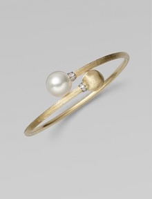 Brushed 18k yellow gold, luminous diamonds, and an iridescent pearl richly combine to create this artistic, elegant design.Diamonds, 0.06 tcw Freshwater pearl 18k yellow gold Diameter, about 2½ Made in Italy