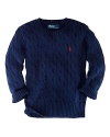 The long-sleeved crewneck sweater is cable-knit in soft combed cotton for a classic, iconic look.