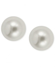 With simulated pearls on a base crafted from gold-tone mixed metal, these earrings from Anne Klein evoke a classic and elegant style. Approximate drop: 10 mm.