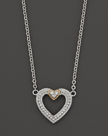 Modern open heart pendant necklace with white sapphires and 18 Kt. gold accents. Designed by Judith Ripka.